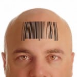 Bald man with barcode on forehead signifying that Successful Business Mindset Delivers