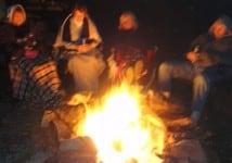 Moments celebrating with people around a campfire