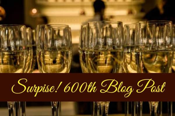 600th Blog post of Brilliant Breakthroughs, Inc. depicted by 12 champagne glasses half filled and a a golden light behind them. It's quite elegant!
