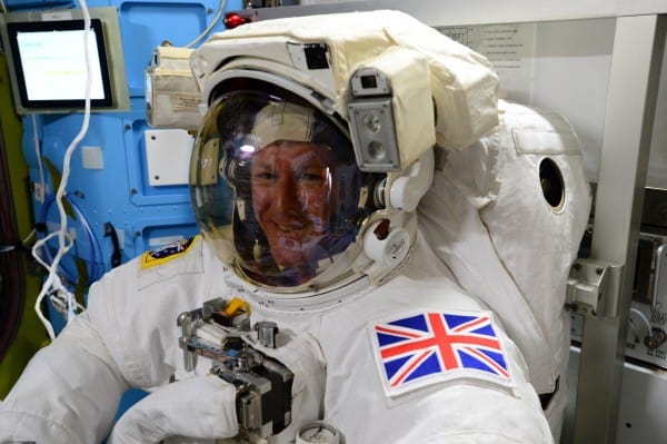 YOUR Business Purpose illustrated through the precision of preparing for a Galactic Spacewalk at the International Space Station. Image of European Astronaut from Britain wearing his space suit while still inside the station.