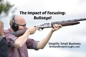 Small Business Coaching by Brilliant Breakthroughs, Inc. Focusing on 5 technique illustrated by a man seriously focusing as he aims to hit his bullseye with a shotgun.