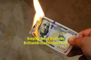Small Business Coaching by Brilliant Breakthroughs, Inc. Business Power Moves illustrated by a $100 bill burning.
