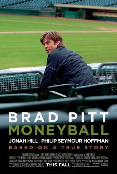 Small Business Coaching by Brilliant Breakthroughs, Inc. Business Movie Review Moneyball illustrated with Movie Poster of Oakland A's GM sitting in the stadium.