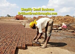 Small Business Coaching by Brilliant Breakthroughs, Inc. Proper Preparation illustrated by man laying brick foundation for building.