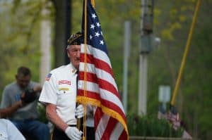 Small Business Coaching by Brilliant Breakthroughs, Inc. Memorial Day honored with veteran color guard marking with American Flag.