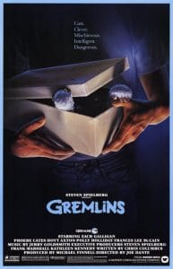 Gremlins movie poster with boy opening his gift.