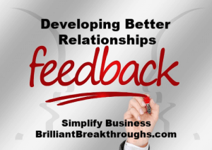 Two faces in background with the word feedback in the middle to help develop better relationships
